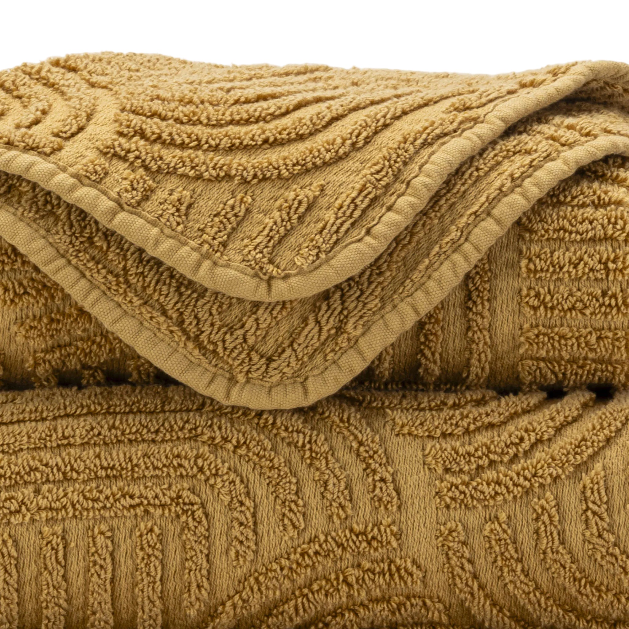 Close-up of a textured gold blanket with intricate patterns.