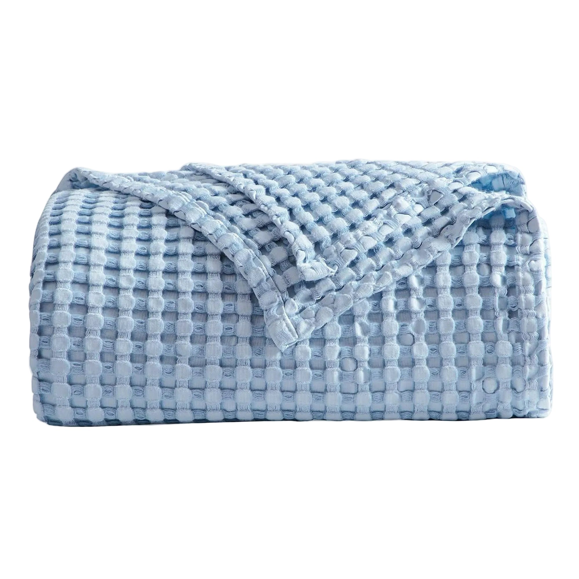 Folded blue textured blanket on a white background